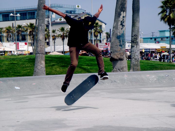 Skateboarder Kickflip Venice Beach California