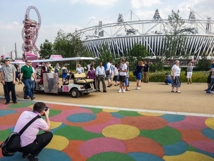A man takes a photo of Colourful flooring. (cell phone photo)