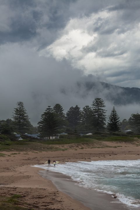 Surfers Getting Out Of The Ocean Gerringong Surfers NSW Australia