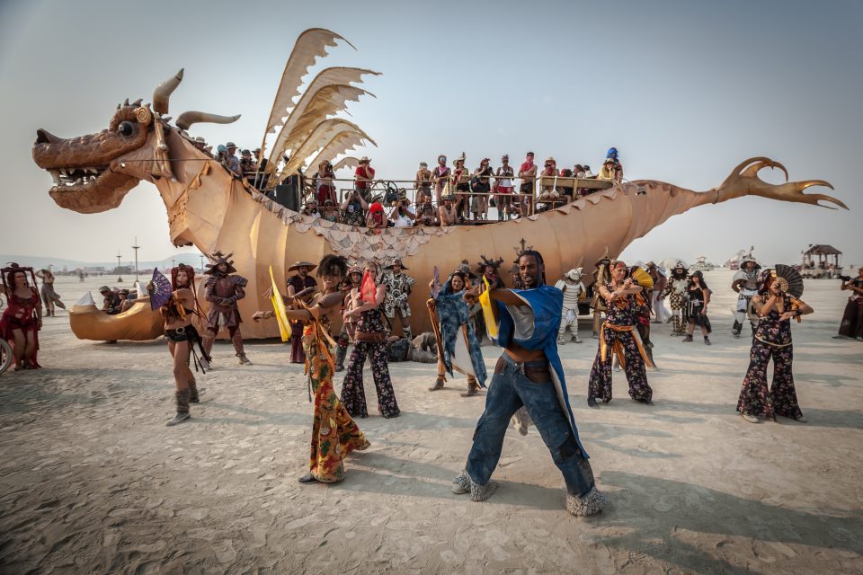 Burners Perform A Dance In Front Of The Abraxas Dragon Art Car Burning Man 2013