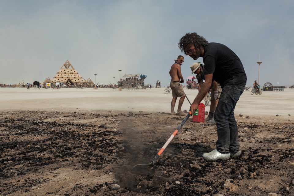 Artist Dadara Cleaning Up After The Like Burn Burning Man 2013