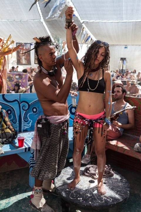Getting Painted Up At Center Camp Burning Man 2013