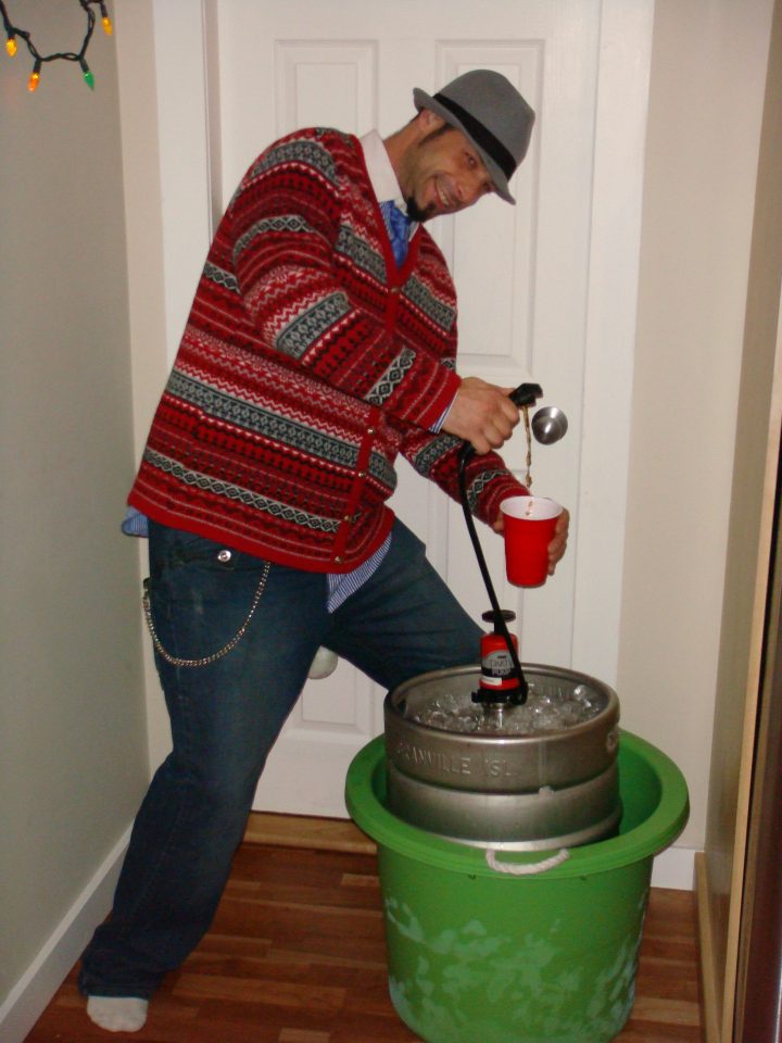 rick with a cosby sweater and a keg