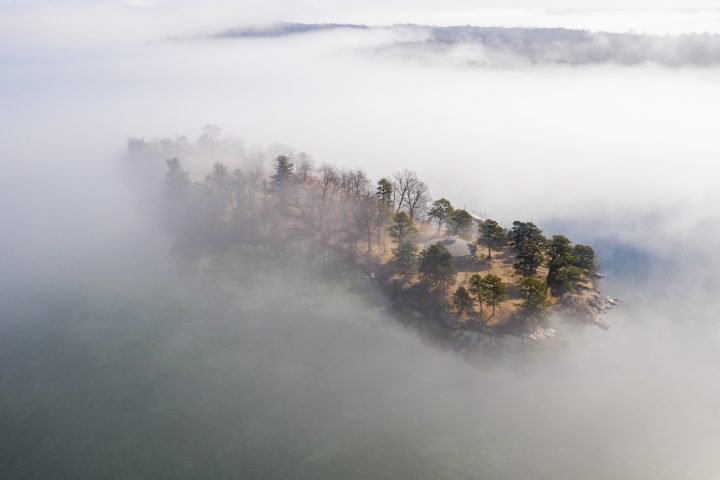 Small Island With Round House In The Fog