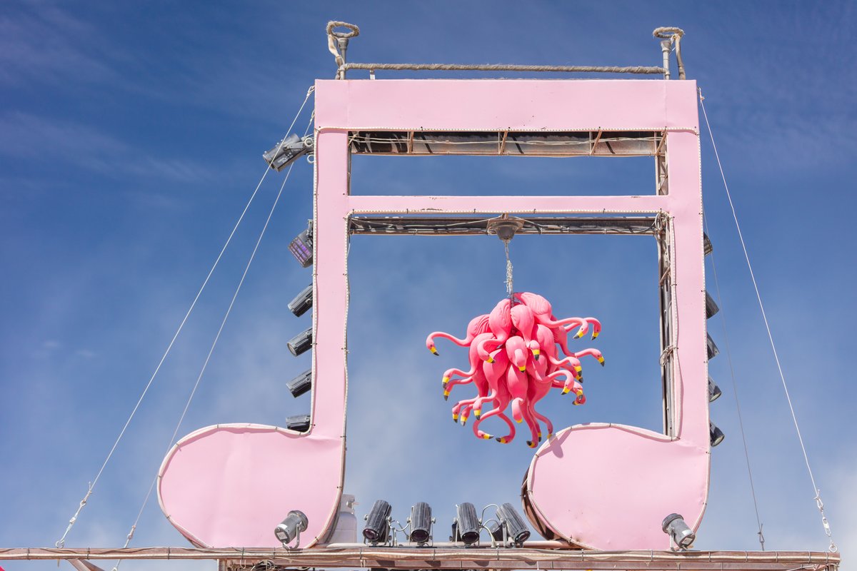 Musical note and plastic Flamingos atop mutant vehicle. Name Unknown