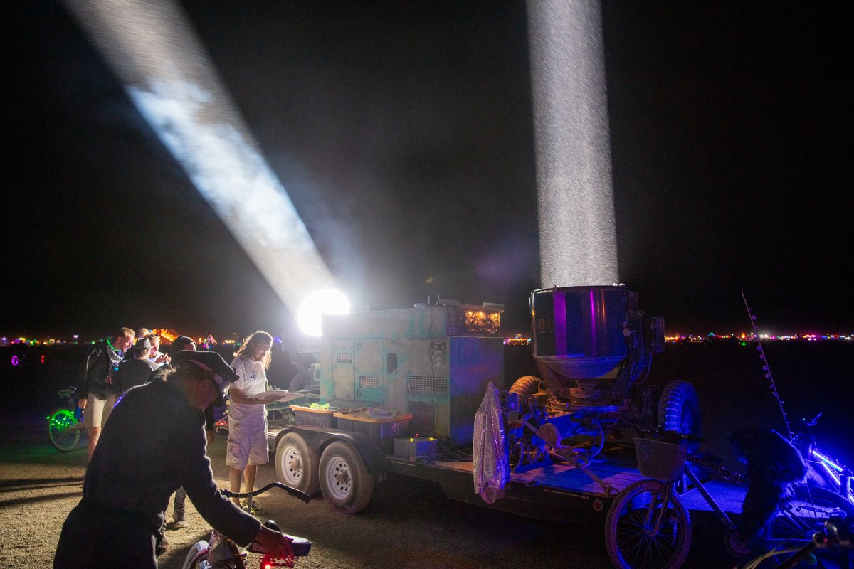 One of my favorite experiences this burn was controlling these 500AMP spotlights wirelessly using a tablet. You drag your finger across the tablet screen and the spotlights move accordingly. Also these folks let me put on welders glasses so I could stick my face in front of the beam and see the arc light. It was scary as hell and my face got hot very fast but damn was it incredible! Thank you! (These were previously military spotlights that would have infrared beams so the battlefield would be illuminated to soldiers wearing infrared goggles... In that situation the beams were invisible to the enemy.) Project Flashlight by: Neal Strickberger from: San Francisco, CA year: 2019 Project flashlight is the joy of light at grand scale. Pure, incredibly bright white beam-like fingers of God in the dust, contrast with the night sky, scale across the open playa, interplay of beams, light in motion. Military/NASA billion-candlepower searchlights, reanimated for art! Interactive with tablet controls. URL: http://projectflashlight.org Contact: info@projectflashlight.org https://burningman.org/event/brc/2019-art-installations/?yyyy=&artType=B#a2I0V000001AY00UAG
