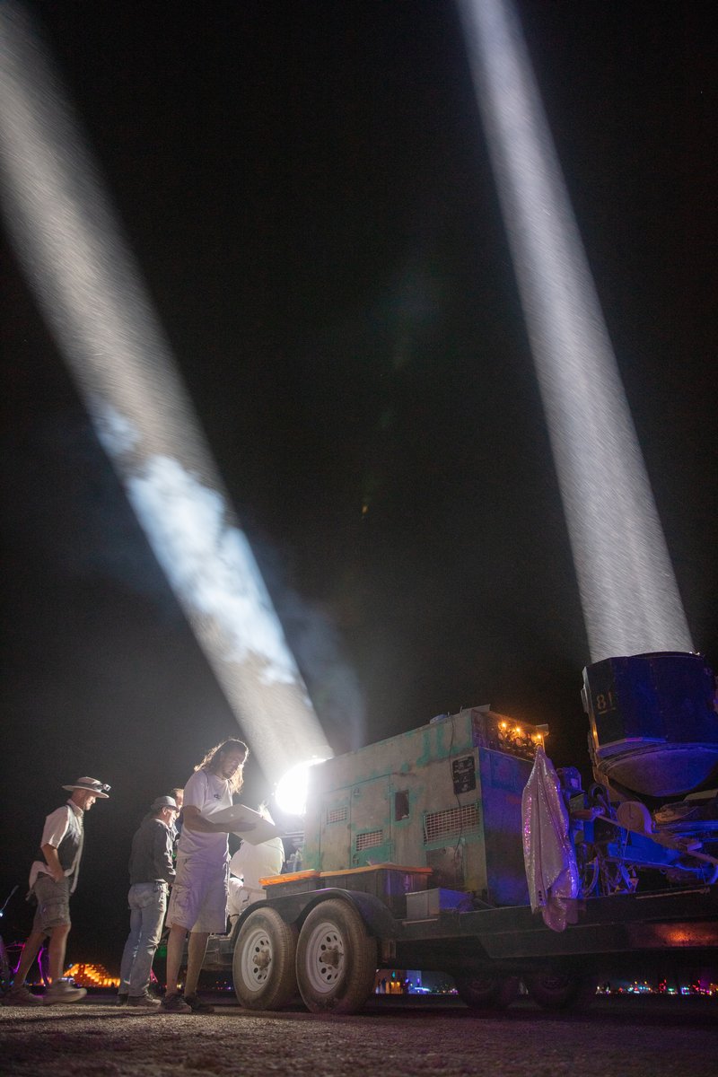 One of my favorite experiences this burn was controlling these 500AMP spotlights wirelessly using a tablet. You drag your finger across the tablet screen and the spotlights move accordingly. Also these folks let me put on welders glasses so I could stick my face in front of the beam and see the arc light. It was scary as hell and my face got hot very fast but damn was it incredible! Thank you! (These were previously military spotlights that would have infrared beams so the battlefield would be illuminated to soldiers wearing infrared goggles... In that situation the beams were invisible to the enemy.) Project Flashlight by: Neal Strickberger from: San Francisco, CA year: 2019 Project flashlight is the joy of light at grand scale. Pure, incredibly bright white beam-like fingers of God in the dust, contrast with the night sky, scale across the open playa, interplay of beams, light in motion. Military/NASA billion-candlepower searchlights, reanimated for art! Interactive with tablet controls. URL: http://projectflashlight.org Contact: info@projectflashlight.org https://burningman.org/event/brc/2019-art-installations/?yyyy=&artType=B#a2I0V000001AY00UAG