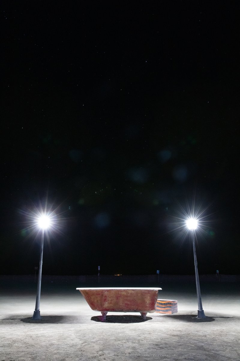 Bathtub near the trash fence at night. Name unknown.