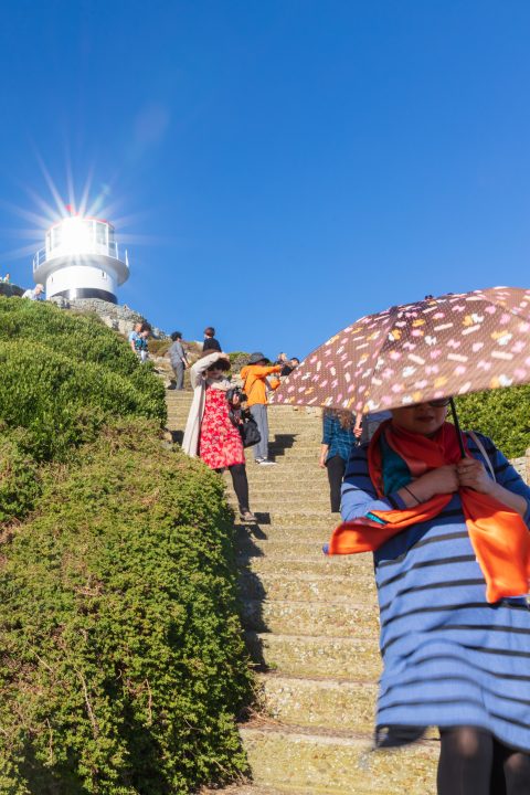 Lady with Umbrella and Lighthouse