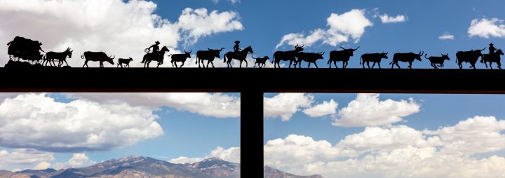 Metal Silhouette of Cowboys on a Cattle Drive