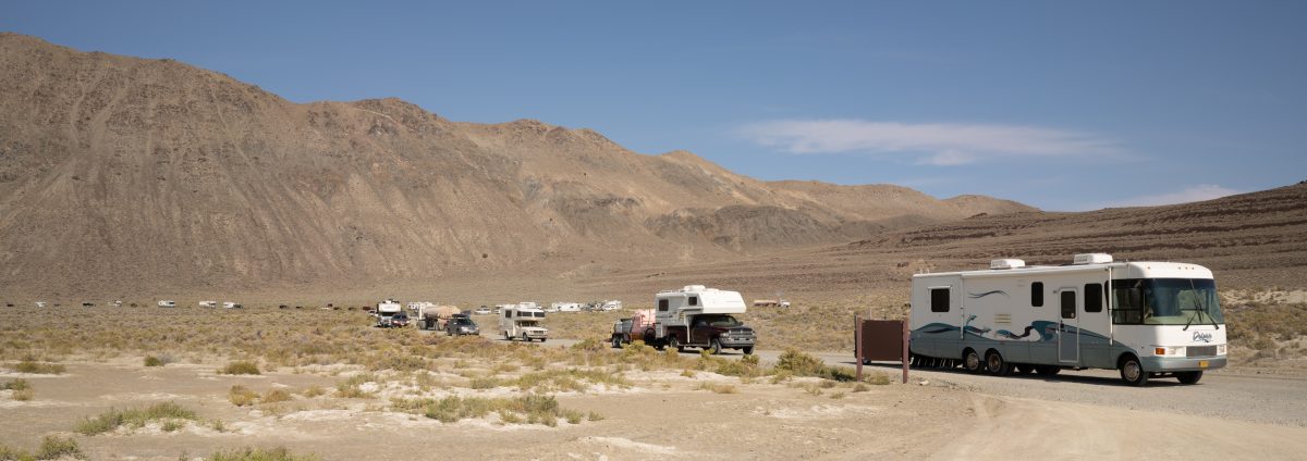 Vehicles make their way onto the playa.