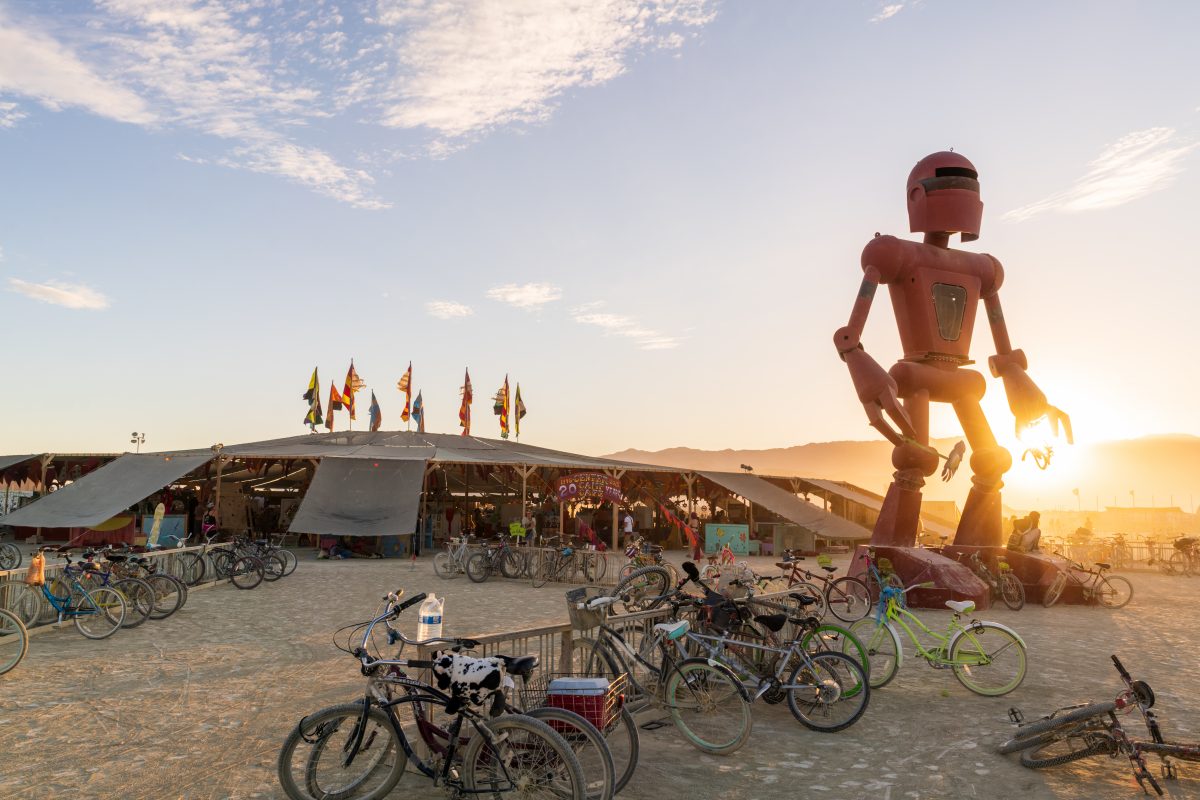 Becoming Human from: El Prado, NM year: 2015  Becoming Human is a 30-foot tall sculpture of a robot, which occasionally smells the flower in its right hand. The sculpture hopes to inspire viewers to ask questions about technology and nature, and the value of slowing down. Contact: crobox@gmail.com