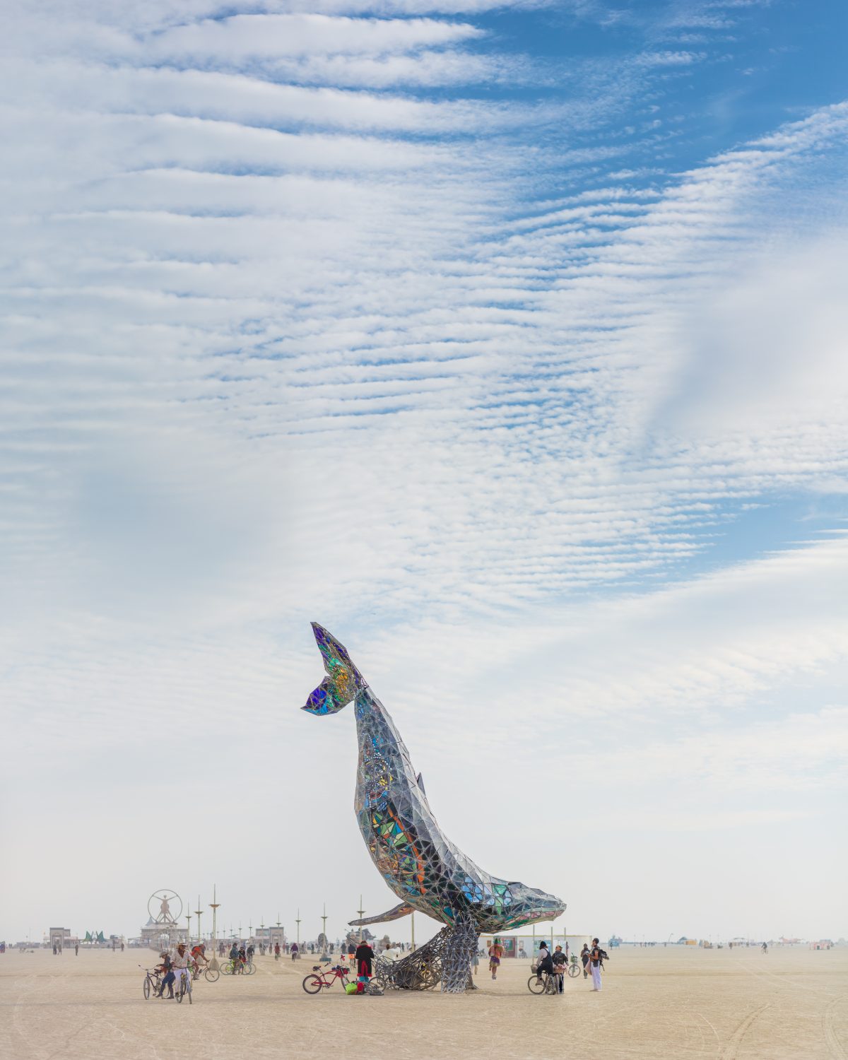 Waves in the Clouds at The Space Whale from: Reno, NV year: 2016  The Space Whale is a 50 foot tall full-scale crystalline humpback whale mother and calf diving through the sky built from steel and stained glass. A monumental testament to family, our relationships with nature, time and space and ...