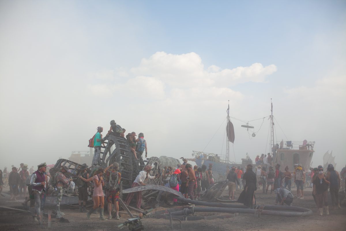 Burners explore the debris and ashes the morning after the Man Burn 2016.
