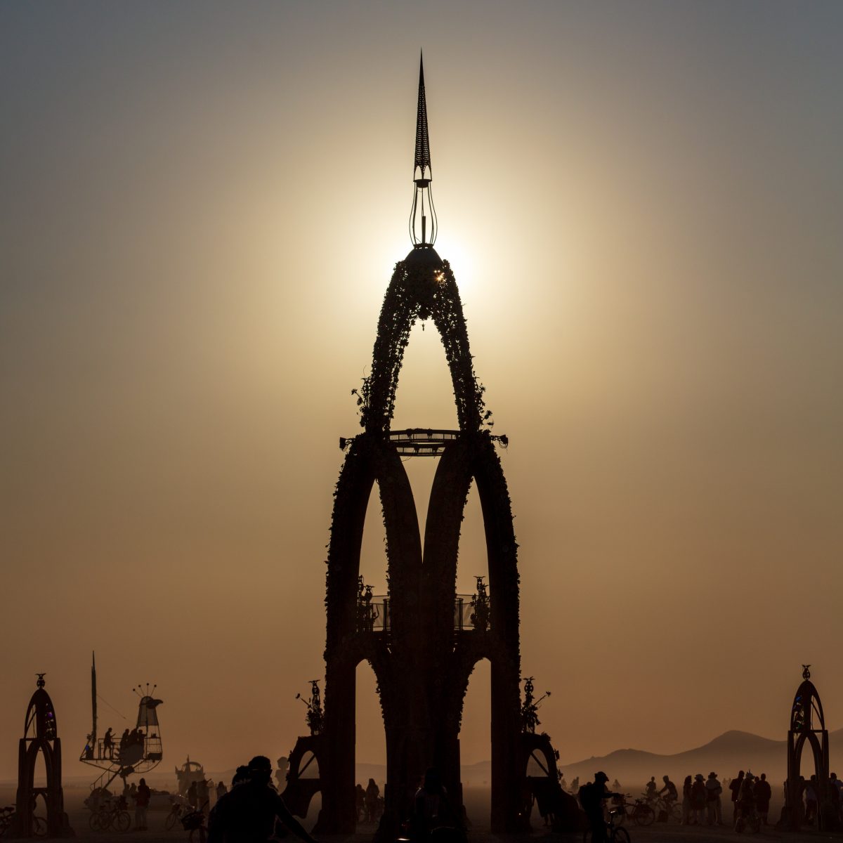 The Flower Tower is a 70 foot tall metal structure ornately decorated by thousands of painted metal flowers, some of which will blow fire. Contact: flowertower@rearedinsteel.com