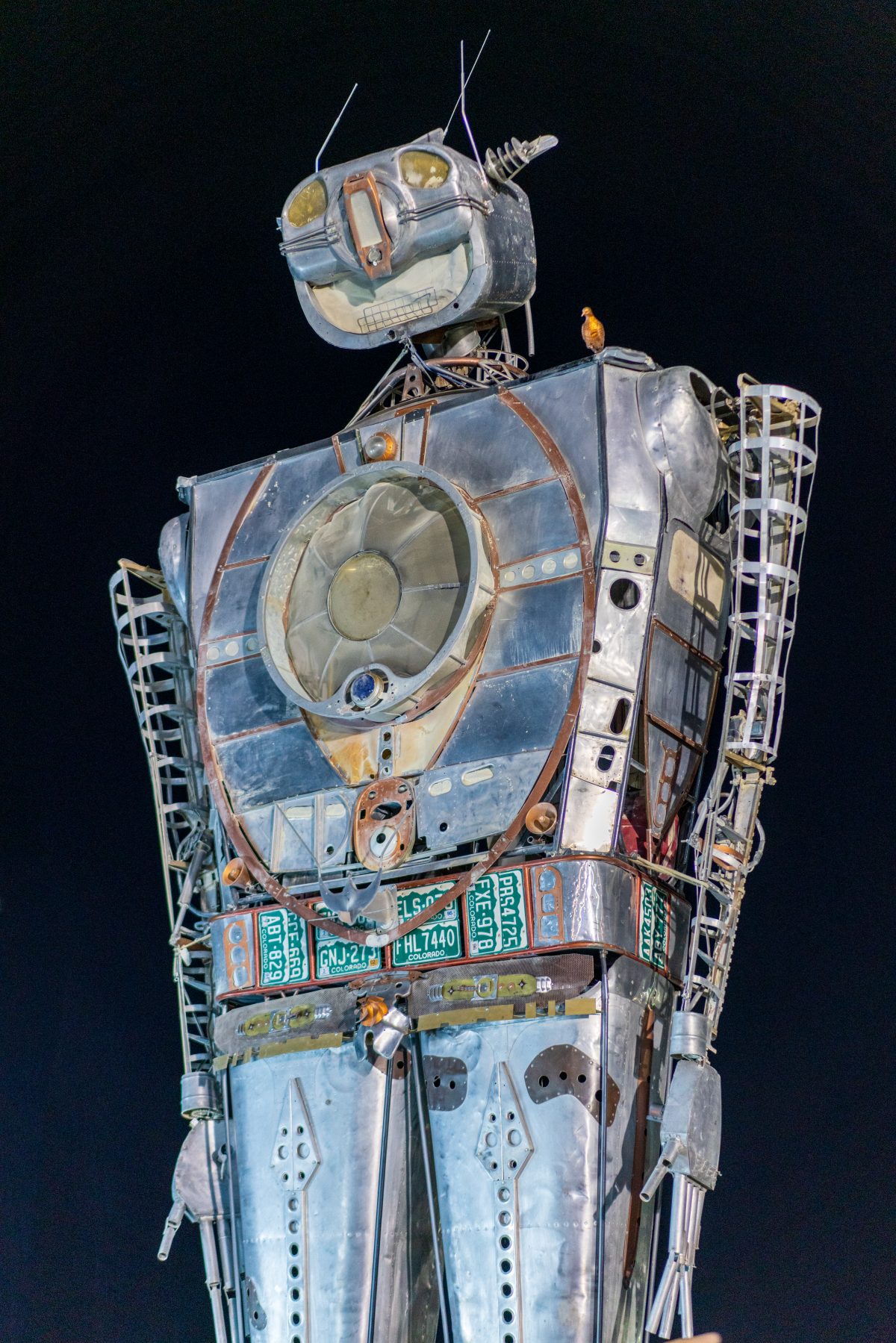 Robot Resurrection by: Shane Evans from: Denver, CO year: 2018  Robot Resurrection is towering 30 foot tall, human piloted, articulating sculpture made from reclaimed airplane parts and found objects. From the torso cockpit, the operator(s) manipulate the Robot's motions and fire effects. This pi...
