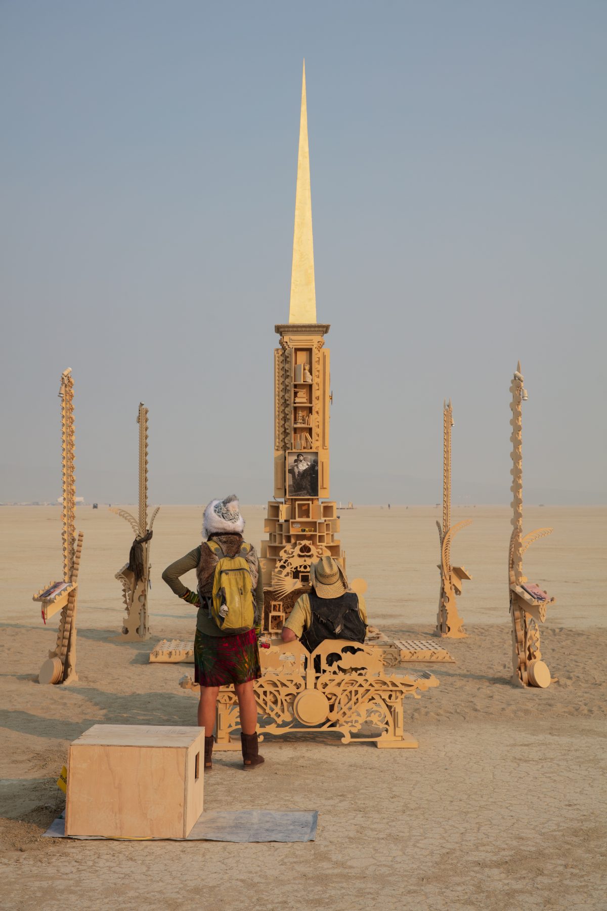 The Larry Memorial by: Dana Albany, Andrew Johnstone, David Best, Flash Hopkins from: San Francisco, CA year: 2019  A stepped pyramid crowned with a palanquin and large spire, flanked on each corner by lamplighter spires. It serves as a physical representation of Larry's mind palace and contains ...