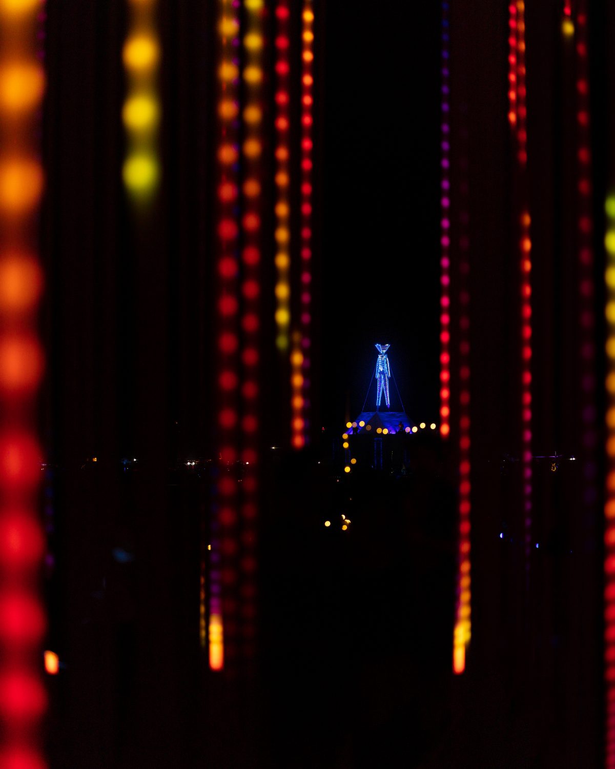 Hexatron by: Mark Lottor from: Menlo Park, CA year: 2018 A forest of 486 20ft tall LED light poles, arranged in a hexagon shape of approximately 90ft diameter, displaying 3D computer contr'd effects.