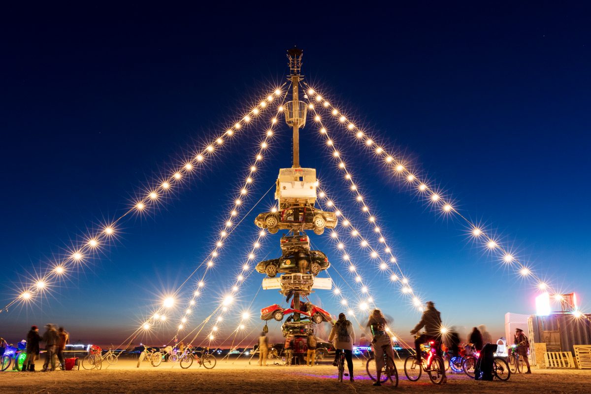 Night at the Climb In by: Dustin Weatherford from: Reno, NV year: 2018 Night at the Climb In will be a 70 foot tall stack of reclaimed junkyard cars, stacked straight up, one on top of the next. Every car will be climbable, visitable, interactive in its own way. The stack will end in a crows nest...