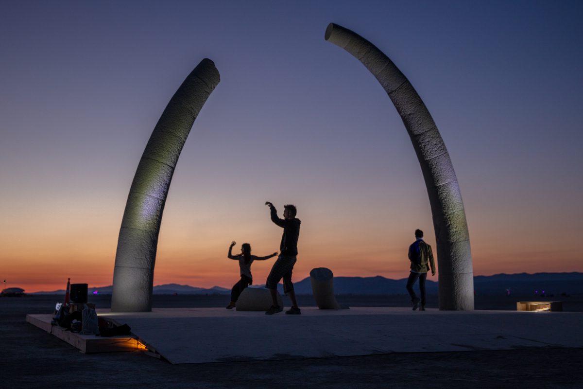 Dancers at Resolute Arch by: Richard Rhodes, Sculptor from: Seattle, WA year: 2018  The Resolute Arch is conceived as gathering place and high-impact landmark on the horizon. it's intended to start a conversation, draw the viewer towards an unexpected conclusion and experience. Appearing broken a...
