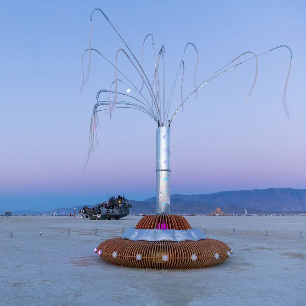 Stardust by: Paige Tashner from: Richmond, CA year: 2018  Stardust's overall look is ethereal and otherworldly. By night, playa travelers will be drawn to a glowing, low-lying mystery disc. As they venture closer they'll see that the disc is actually a flying saucer - and a comfy bench! A Galacti...