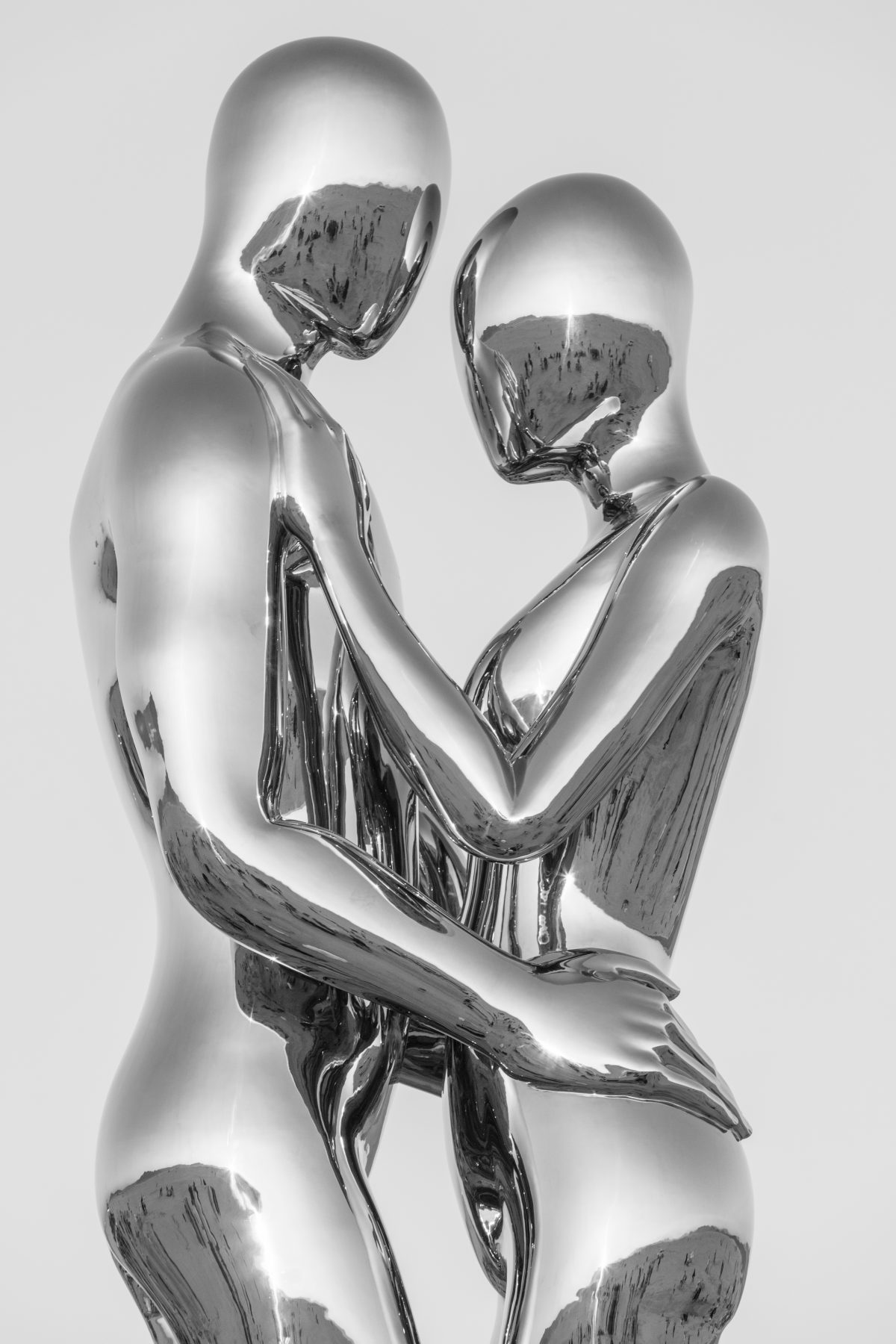SENTIENT AI by: Michael Benisty, Love and Unity from: Brooklyn, NY year: 2018  A sculptural representation of Male and Female holding one another in a symbolic and universal position of caring in a display of Love and Unity. Measuring 25 feet tall and made out of mirror polished stainless steel. ...