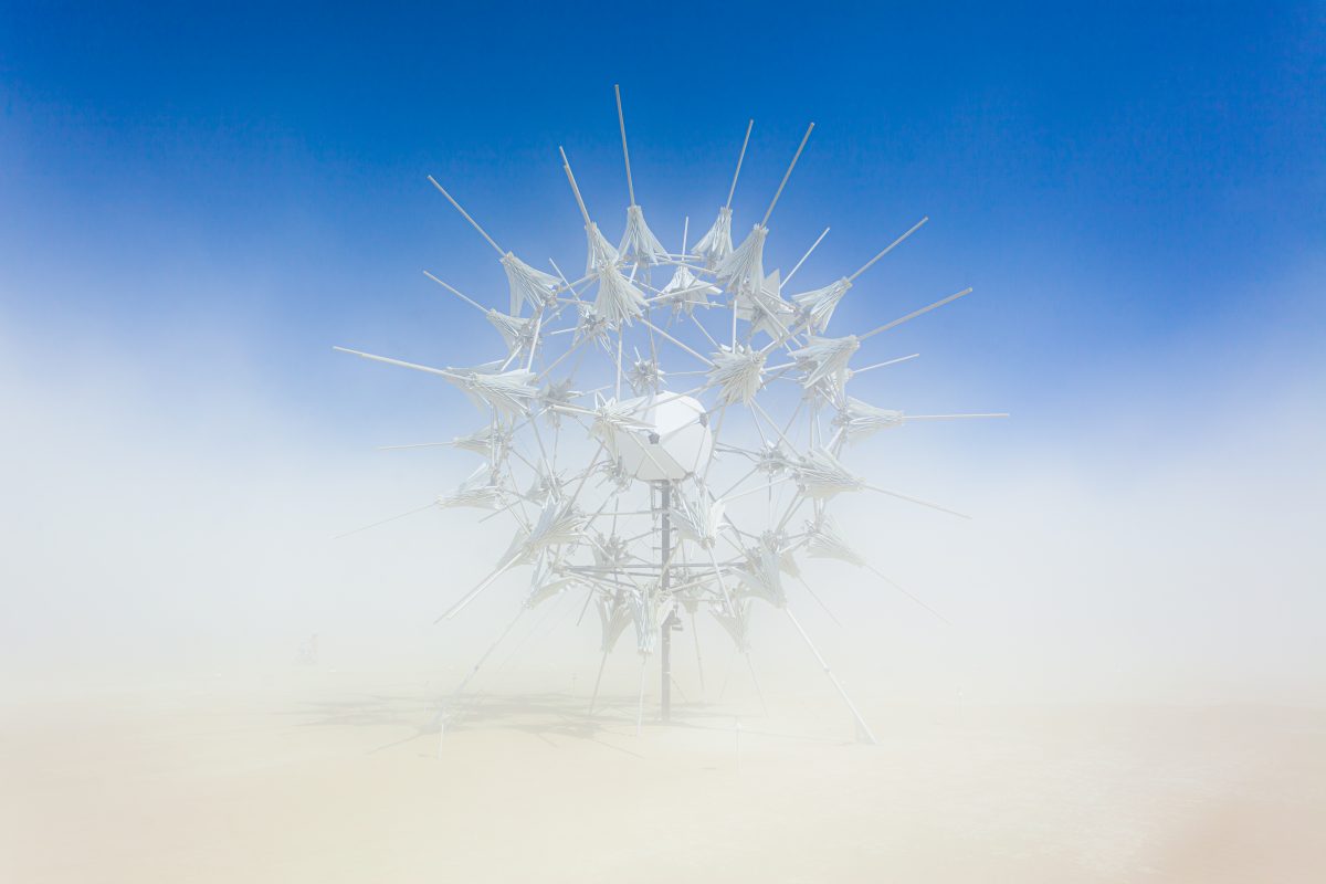 RadiaLumia by: FoldHaus Collective from: Oakland, CA year: 2018  RadiaLumia is a geodesic sphere, five-stories tall, and covered with a breathing skin of origami shells and radiant spikes. Its shape nods to radiolaria, a tiny protozoa with intricate mineral skeletons that covered the desert thous...