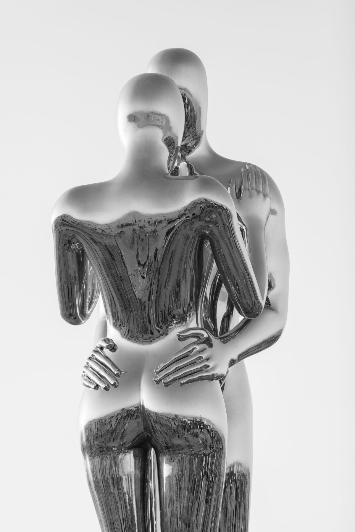 SENTIENT AI by: Michael Benisty, Love and Unity from: Brooklyn, NY year: 2018  A sculptural representation of Male and Female holding one another in a symbolic and universal position of caring in a display of Love and Unity. Measuring 25 feet tall and made out of mirror polished stainless steel. ...