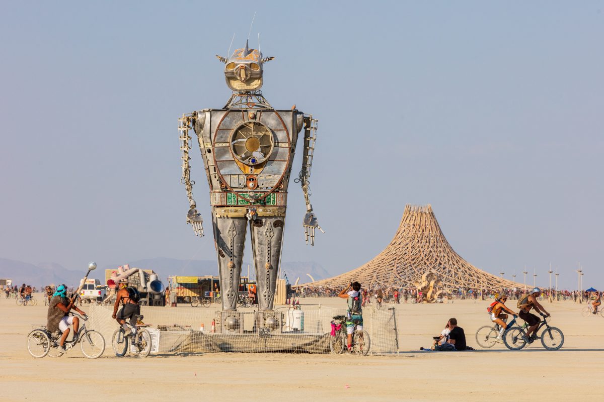 Robot Resurrection by: Shane Evans from: Denver, CO year: 2018  Robot Resurrection is towering 30 foot tall, human piloted, articulating sculpture made from reclaimed airplane parts and found objects. From the torso cockpit, the operator(s) manipulate the Robot's motions and fire effects. This pi...