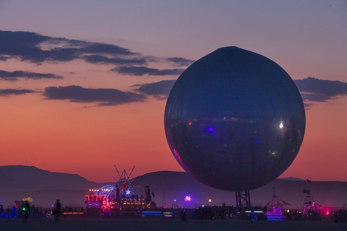 The ORB by: Bjarke Ingels, Jakob Lange, and I, Orbot from: Valby, Copenhagen, Denmark year: 2018  Inspired by NASA's Project Echo, the ORB is an inflatable structure to levitate above the playa. The reflective skin will mirror the full layout of BRC from the ground, allowing for easier navigation...