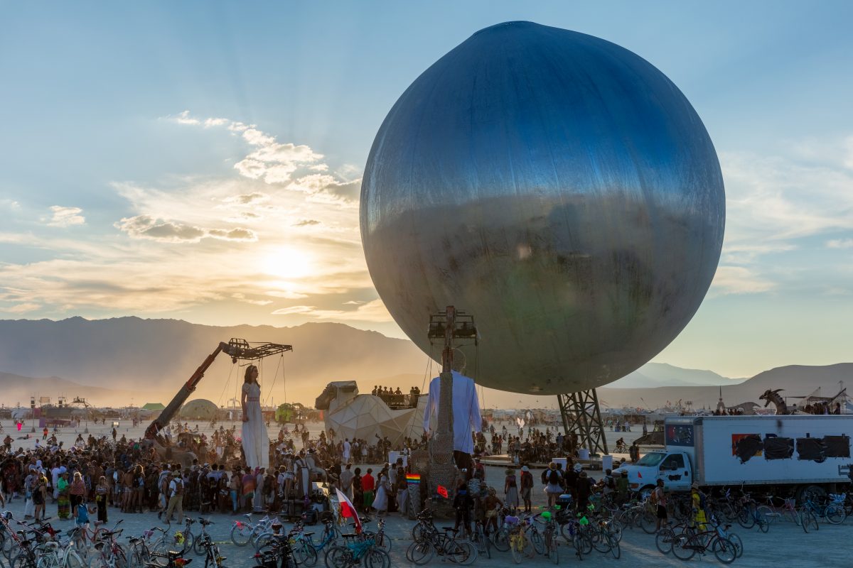 The ORB by: Bjarke Ingels, Jakob Lange, and I, Orbot from: Valby, Copenhagen, Denmark year: 2018  Inspired by NASA's Project Echo, the ORB is an inflatable structure to levitate above the playa. The reflective skin will mirror the full layout of BRC from the ground, allowing for easier navigation...