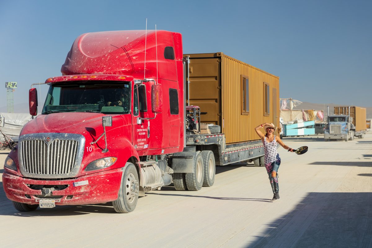 My friend Vanessa and some big trucks.