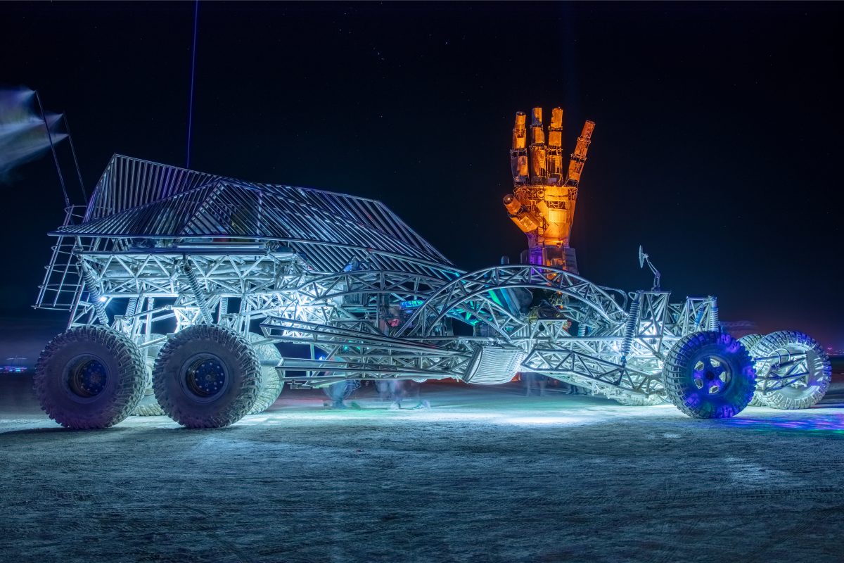 Henry Chang's Flux Capacitor Mutant vehicle and I.L.Y by: Dan Mountain from: Portola Valley, CA year: 2019 A 27 foot forearm and hand, fabricated from engineered steel, recycled and repurposed scrap metal meant to engage participants in various visual, physical, and emotional ways. Housing an int...