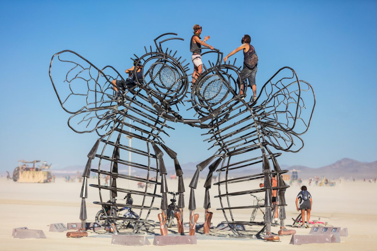 Bee Dance by: Andrea Greenlees, Andy Tibbetts, and Josh Haywood from: London, UK & Reno, NV year: 2019 Bee Dance is a whimsical and inviting art installation in the form of two gigantic Dancing Bees, their legs entwined and their heads touching in a bee kiss. It celebrates one of the most fas...
