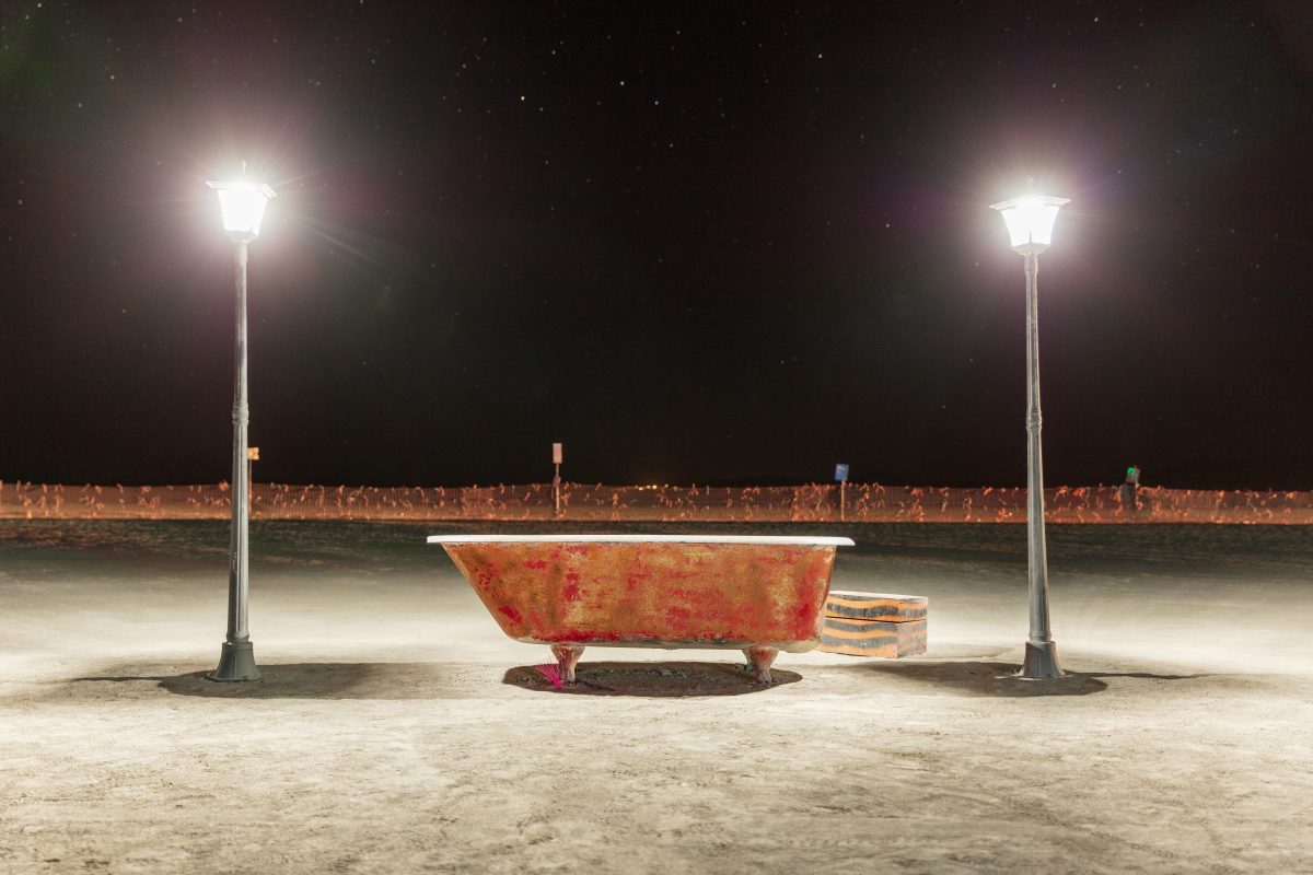 Bathtub near the trash fence at night. Name unknown.