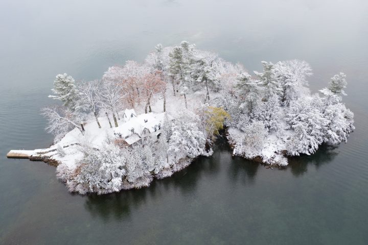 Snow Covered Island with Home and Dock