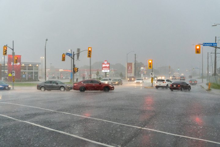 Cars Driving in the Rain at Intersection