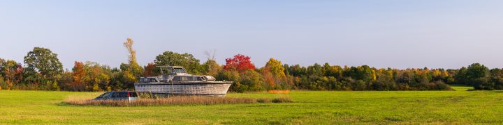 Boat and Van in Field