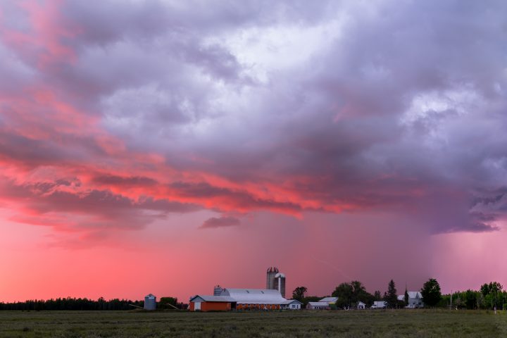 Storm Over Farm at Sunset