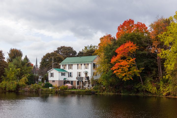 House on Riverbank and Fall Color