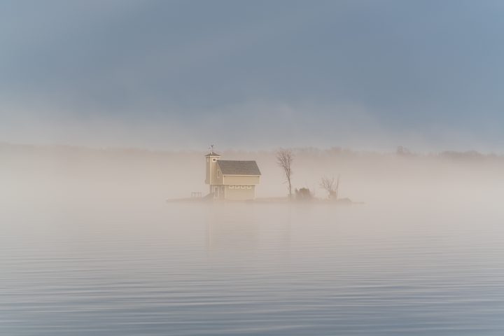 Tiny Cottage on Small Island in the Fog