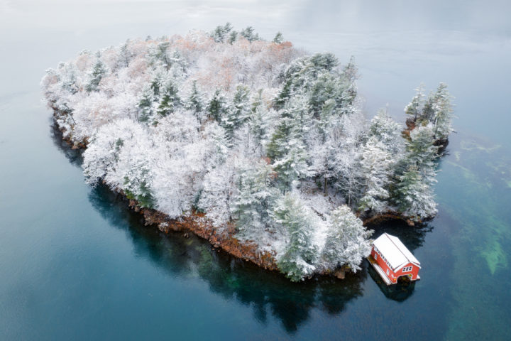 Small Island with Red Boathouse and Fresh Snow
