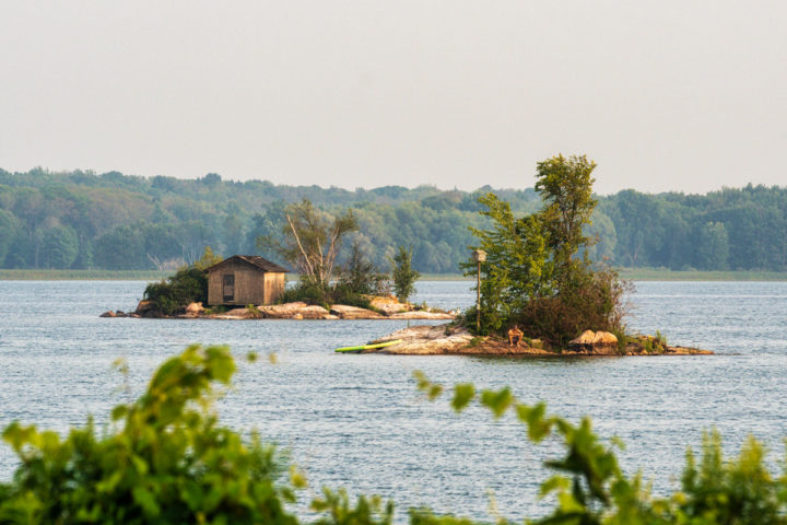 Paddleboarder Taking a Break on a Small Island