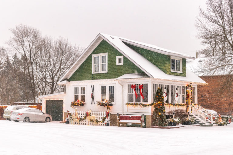 House with Christmas Decorations in the Snow