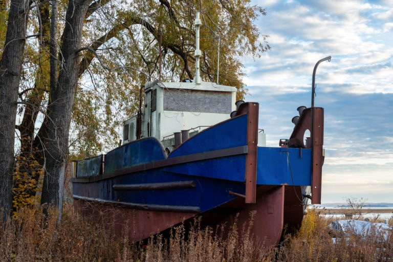 Boarded up Vessel and Trees