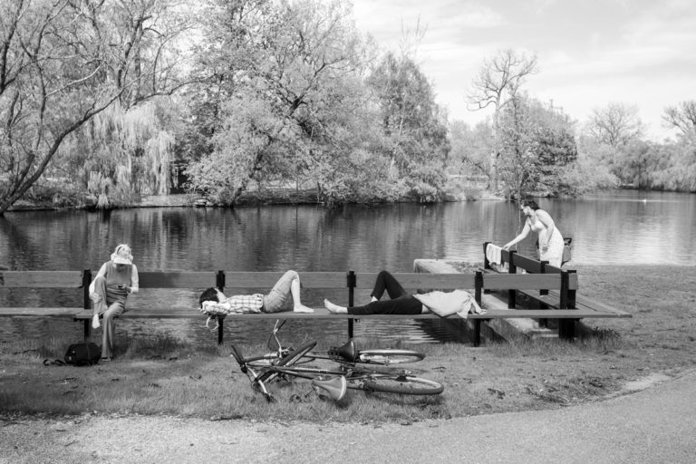 People Resting on a Bench