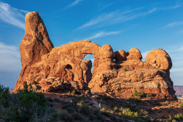 Man Walking at Arch