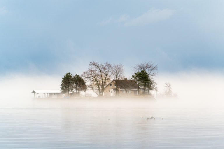 Small Island with Cottage in the Fog