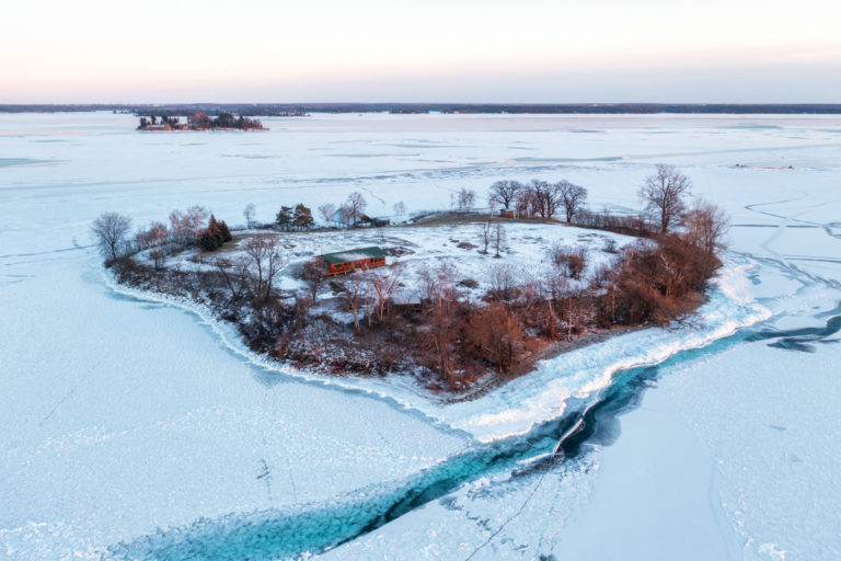 Island with Cottage Surrounded by Ice