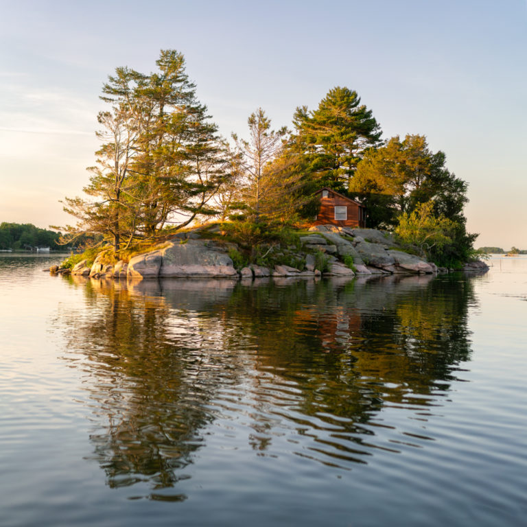 Small Island with Cottage at Sunset
